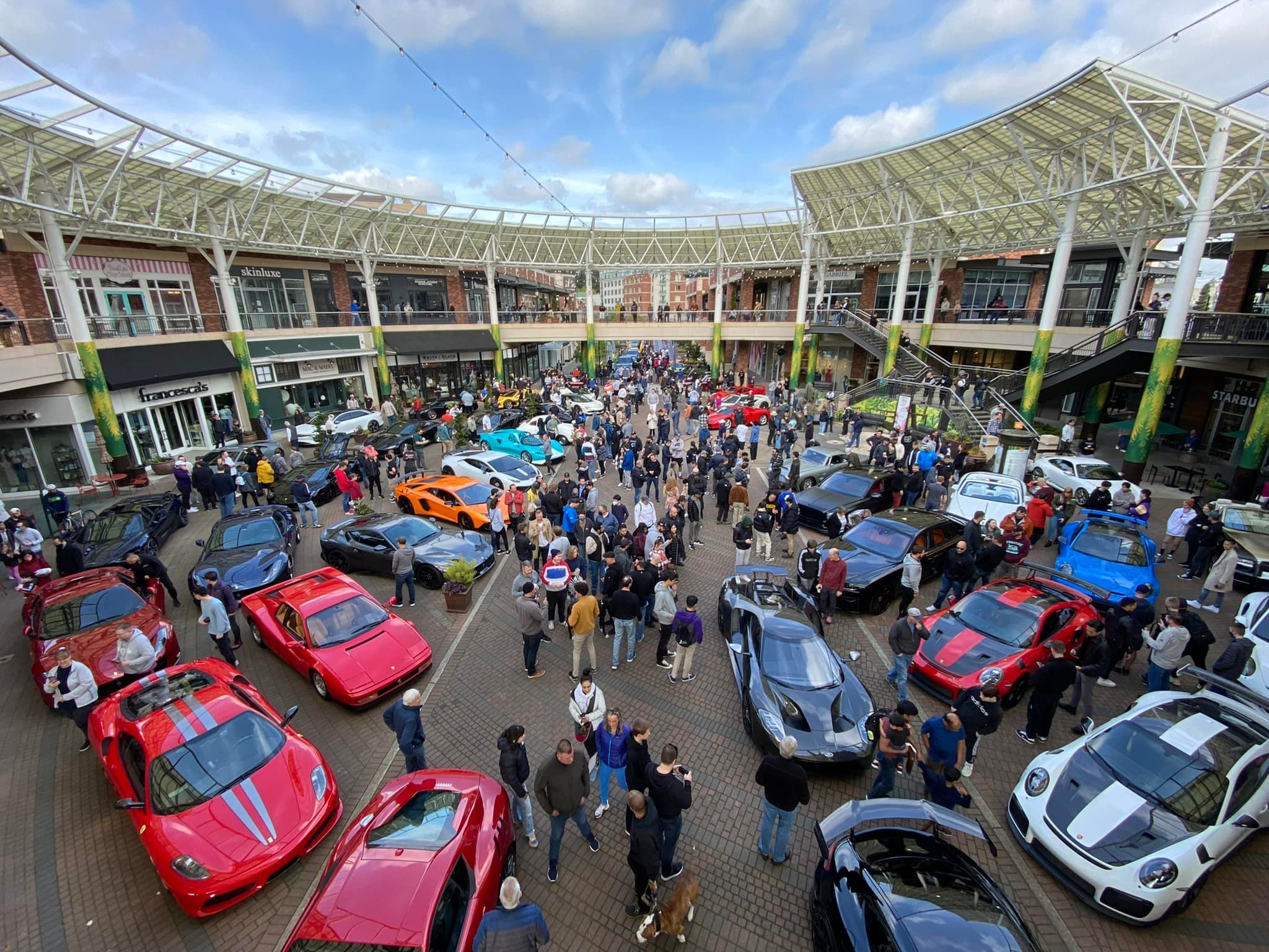 Exotic cars line up at Redmond Town Center, showcasing the vibrant community and automotive passion.